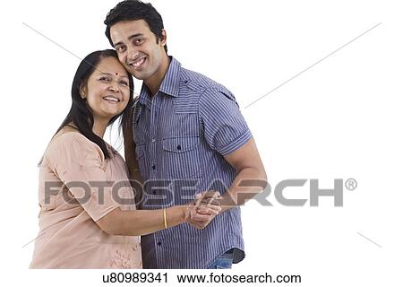 Portrait of mother and son dancing over white background View Large Photo Image Stock Image - Portrait of mother and son dancing over white background . Fotosearch