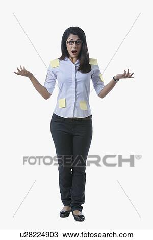 Portrait of shocked businesswoman covered with adhesive notes standing over white background View Large Photo Image Stock Image - Portrait of shocked businesswoman covered with adhesive notes standing over white background. Fotosearch