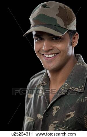 Portrait of smiling male soldier over black background View Large Photo Image Stock Image - Portrait of smiling male soldier over black background . Fotosearch