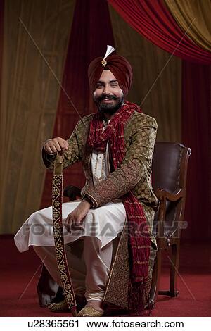 Portrait of smiling man in traditional clothes View Large Photo Image Stock Image - Portrait of smiling man in traditional clothes . Fotosearch