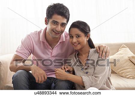 Picture - Portrait of smiling young couple at home . Fotosearch