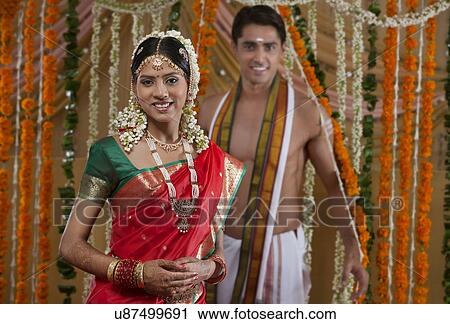 Portrait of smiling young couple on their wedding day View Large Photo Image Stock Image - Portrait of smiling young couple on their wedding day . Fotosearch