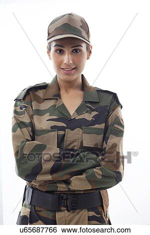 Portrait of smiling young female soldier against white background View Large Photo Image Stock Photograph - Portrait of smiling young female soldier against white background . Fotosearch