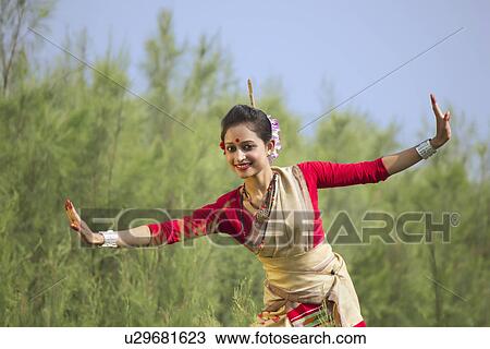 Portrait of woman doing Bihu dance View Large Photo Image Stock Image - Portrait of woman doing Bihu dance . Fotosearch