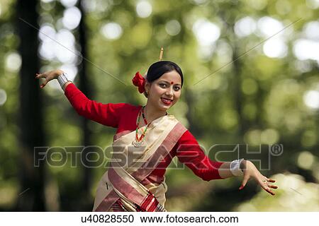 Portrait of woman doing Bihu dance View Large Photo Image Stock Image - Portrait of woman doing Bihu dance . Fotosearch