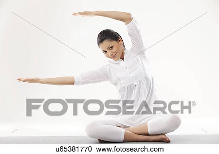 Portrait of woman in casual clothes practicing yoga View Large Photo Image Stock Image - Portrait of woman in casual clothes practicing yoga . Fotosearch