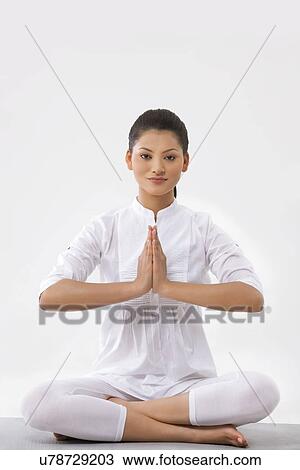 Portrait of woman with hands clasped over white background View Large Photo Image Stock Image - Portrait of woman with hands clasped over white background . Fotosearch