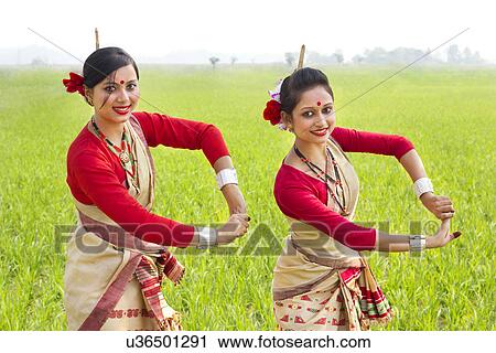 Stock Image - Portrait of women doing Bihu dance . Fotosearch