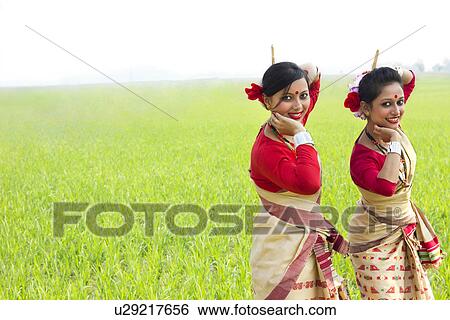 Stock Photograph - Portrait of women doing Bihu dance . Fotosearch