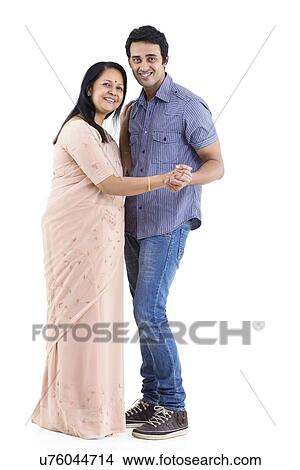 Portrait of young man and mother dancing over white background View Large Photo Image Picture - Portrait of young man and mother dancing over white background . Fotosearch
