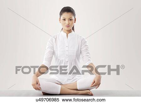 Stock Photography - Portrait of young woman doing yoga . Fotosearch