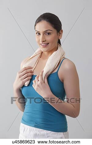 Portrait of young woman wit napkin around her neck isolated over gray background View Large Photo Image Stock Image - Portrait of young woman wit napkin around her neck isolated over gray background . Fotosearch