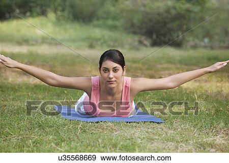 Portrait of young woman with arms outstretched View Large Photo Image Stock Photo - Portrait of young woman with arms outstretched . Fotosearch