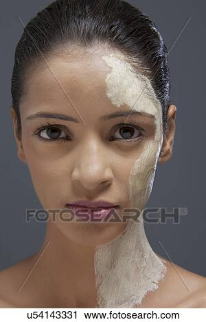Portrait of young woman with facial mask View Large Photo Image Stock Image - Portrait of young woman with facial mask . Fotosearch
