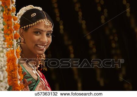 Stock Image - Portrait on an Indian bride smiling . Fotosearch