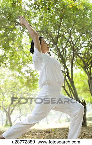 Pretty young woman doing yoga View Large Photo Image Stock Photo - Pretty young woman doing yoga . Fotosearch