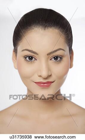 Stock Photo - Pretty young woman over white background . Fotosearch