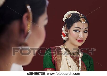 Reflection of beautiful Bharatanatyam dancer in mirror View Large Photo Image Stock Photography - Reflection of beautiful Bharatanatyam dancer in mirror. Fotosearch