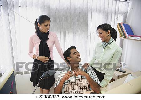 Stock Image - Romance at work . Fotosearch