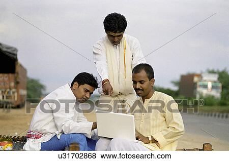 Rural men with a laptop View Large Photo Image Stock Photo - Rural men with a laptop . Fotosearch