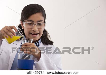 School girl mixing chemicals View Large Photo Image Picture - School girl mixing chemicals . Fotosearch