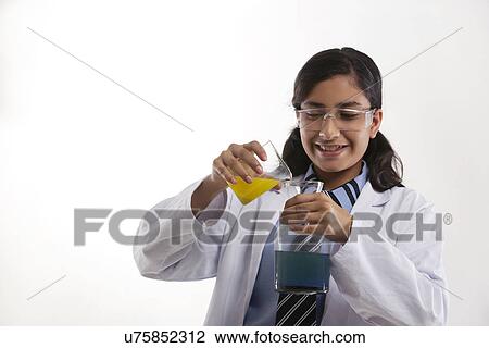 School girl mixing chemicals View Large Photo Image Stock Image - School girl mixing chemicals . Fotosearch