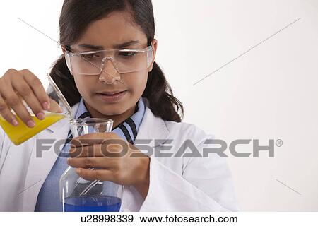 School girl mixing chemicals View Large Photo Image Stock Photo - School girl mixing chemicals . Fotosearch