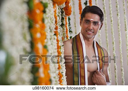Selective focus of man standing near garland View Large Photo Image Picture - Selective focus of man standing near garland . Fotosearch