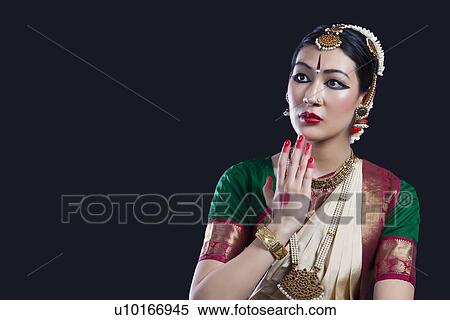 Stock Photography - Shocked Bharatanatyam dancer over black background. Fotosearch