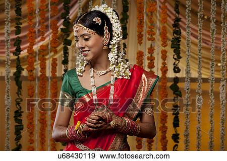 Stock Photo - Shy Indian woman in sari . Fotosearch