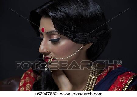Stock Image - Side profile of a beautiful bride. Fotosearch