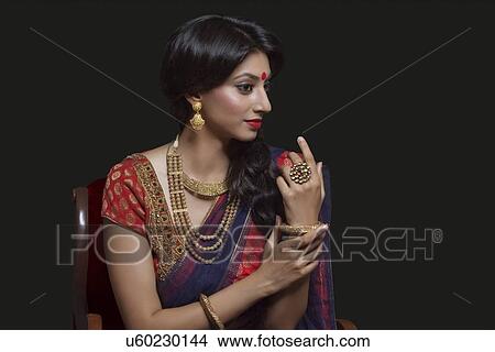 Side profile of a beautiful bride with jewelery View Large Photo Image Picture - Side profile of a beautiful bride with jewelery. Fotosearch