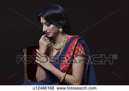 Side profile of a beautiful bride with jewelery View Large Photo Image Stock Photo - Side profile of a beautiful bride with jewelery. Fotosearch