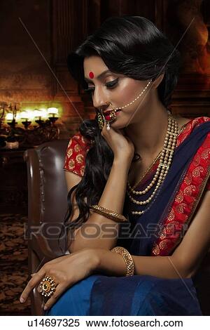 Stock Photography - Side profile of a beautiful bride with jewelery. Fotosearch