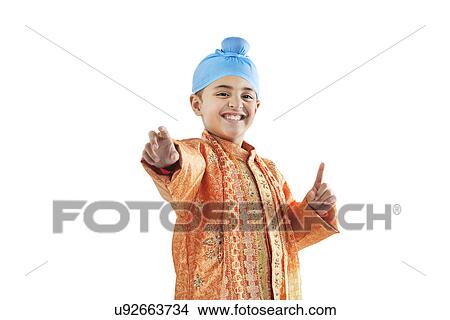 Sikh boy enjoying himself View Large Photo Image Picture - Sikh boy enjoying himself . Fotosearch
