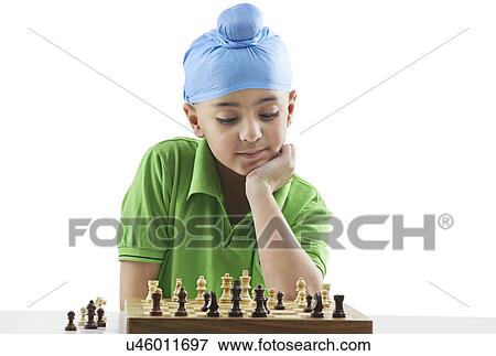 Sikh boy playing chess View Large Photo Image Stock Photo - Sikh boy playing chess . Fotosearch