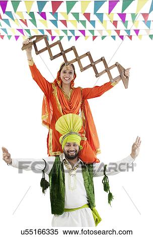 Sikh couple enjoying themselves View Large Photo Image Stock Photography - Sikh couple enjoying themselves . Fotosearch