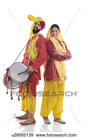 Stock Photo - Sikh couple posing in traditional attire . Fotosearch