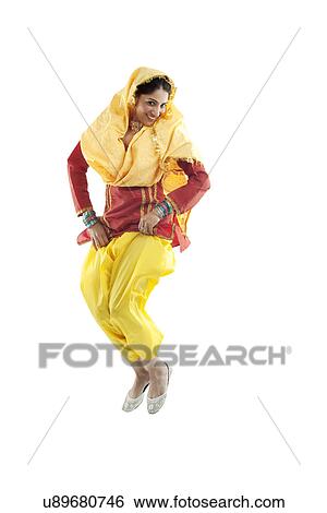 Sikh woman jumping in the air View Large Photo Image Stock Photograph - Sikh woman jumping in the air . Fotosearch