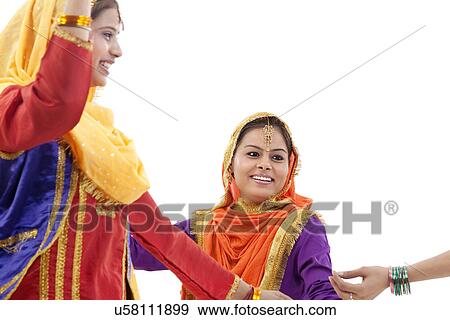 Sikh women dancing View Large Photo Image Stock Photo - Sikh women dancing . Fotosearch