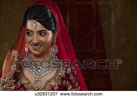 Stock Photo - Smiling bride looking away . Fotosearch