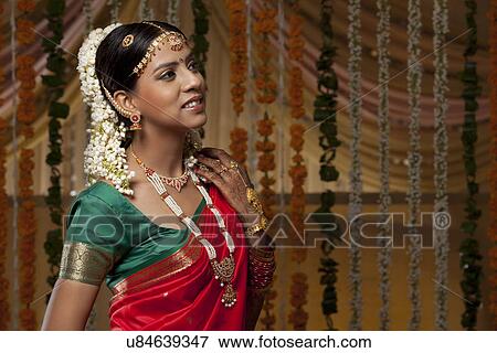 Stock Photo - Smiling bride looking away . Fotosearch