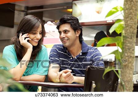 Smiling couple in shopping mall View Large Photo Image Stock Image - Smiling couple in shopping mall . Fotosearch