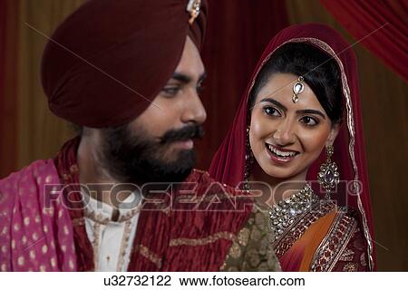 Smiling couple looking at each other View Large Photo Image Stock Image - Smiling couple looking at each other . Fotosearch