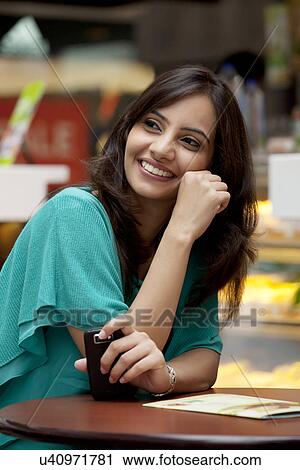 Smiling woman looking away View Large Photo Image Stock Image - Smiling woman looking away . Fotosearch