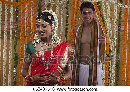Smiling young couple on their wedding day View Large Photo Image Stock Image - Smiling young couple on their wedding day . Fotosearch