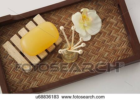 Soap, reed diffuser and orchid in a tray View Large Photo Image Stock Image - Soap, reed diffuser and orchid in a tray . Fotosearch