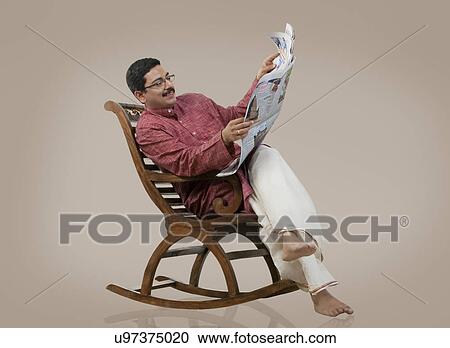 South Indian man reading the newspaper View Large Photo Image Stock Image - South Indian man reading the newspaper . Fotosearch
