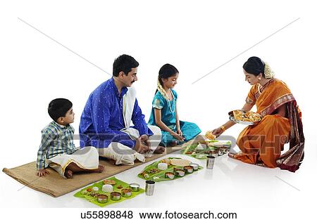 South Indian woman serving food to her family View Large Photo Image Stock Photo - South Indian woman serving food to her family . Fotosearch