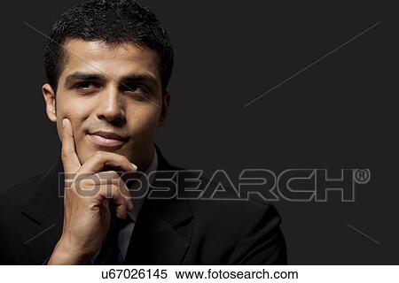 Successful business man looking away View Large Photo Image Stock Photography - Successful business man looking away . Fotosearch